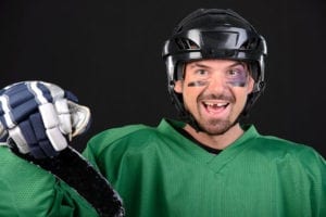 A hocket player with a missing tooth